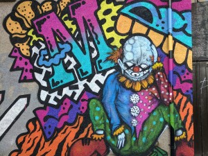 Street art mural of a clown